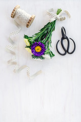 Bouquet of asters decorated with white ribbon