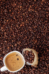 Coffee cup with coffee bag on wooden table. View from top