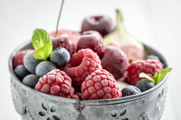 Delicious ice cream sorbet with berry fruits and mint leaf