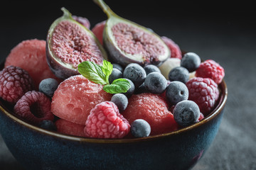 Homemade ice cream sorbet with berry fruits and mint leaf