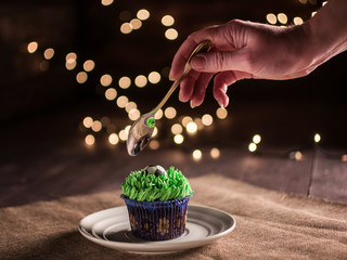 football cake with ball and grass on wooden background