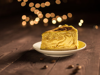 pancake cake with cream and coffee on a white saucer