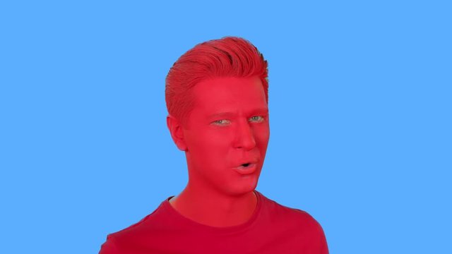 The face of men painted with red paint