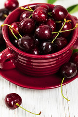 Cherries on White Wooden Background. Selective focus.