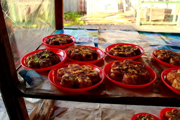 cake maker while working in the kitchen making a typical South Kalimantan Bingka cake in Banjarmasin - Indonesia