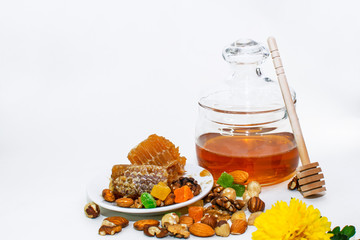 honey and nuts on white background