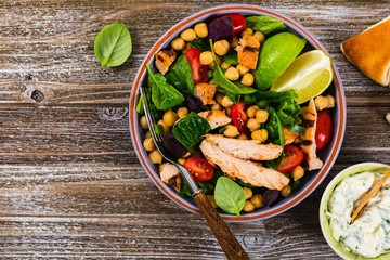 Mediterranean Grilled Chicken Salad with Chickpea or Garbanzo Beans. Selective focus.