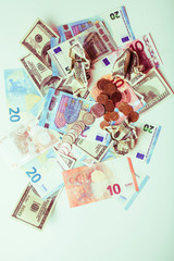 Cash on table isolated: dollars, euro, rubl broken money. All in mess, global crisis concept, dollar rules world