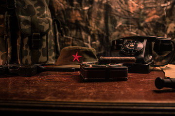 Close up of a Cuban cigar and ashtray on the wooden table. Communist dictator commander table in...