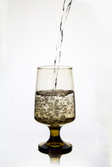 Pouring water into a fancy glass