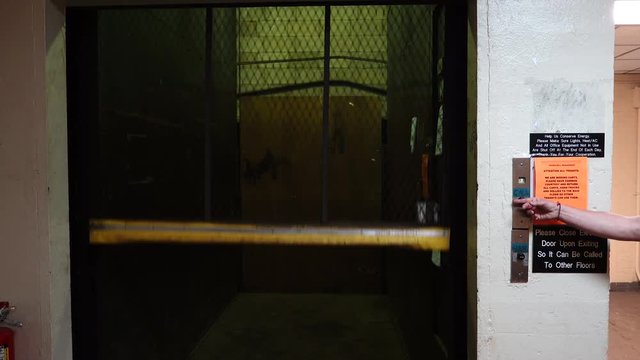 A freight elevator opens and closes