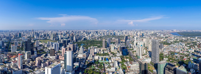 Fototapeta premium The Metropolitan Bangkok City - Aerial Panorama view urban tower Bangkok city Thailand on April 2019 , blue sky background , Panoramic Cityscape Thailand
