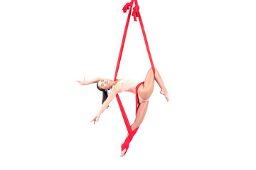 Beautiful woman Asian sport girl fly yoga posing on a red hammock isolated white background ,...