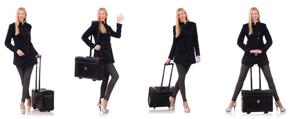 Beautiful woman in black coat with suitcase 