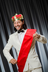 Funny king wearing crown in coronation concept