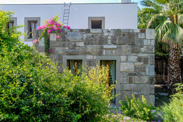 Fototapeta na wymiar Mugla, Turkey, 25 July 2012: Beautiful exterior of authentic Stone Bodrum Mansion, Halicarnassus