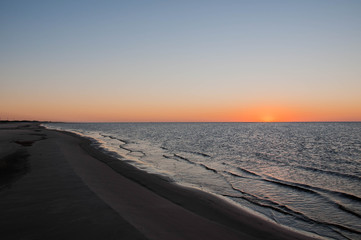 sunset on beach of lagoa mirim