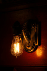 A glowing antique light fixture