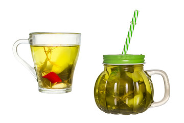 Two glasses with cucumber pickle isolated on white background