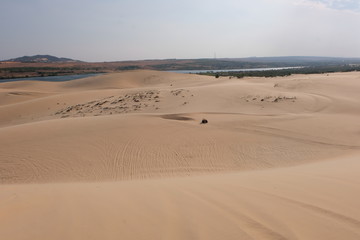 woman tourist and relaxing at white sand dunes