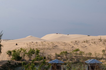 beautiful white sand dune on sunset background