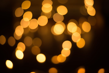 abstract gold bokeh light effect with dark background