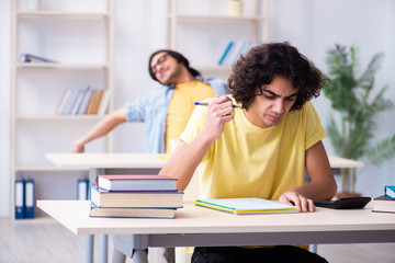 Two male students in the classroom