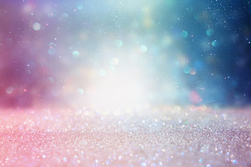 abstract glitter silver, purple, blue and gold lights background. de-focused