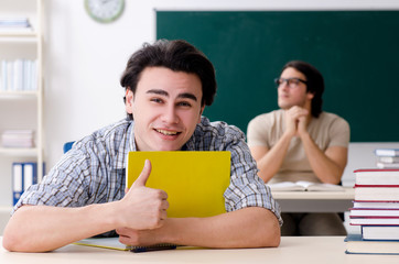 Two male students in the classroom 