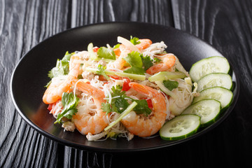 Fototapeta Thai recipe Yum Woon Sen salad with shrimp, pork and vegetables closeup on a plate. horizontal obraz