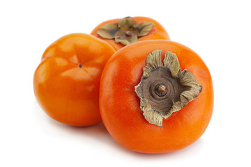 Persimmon fruit closeup on white