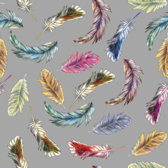 Seamless pattern of colored feathers painted in watercolor
