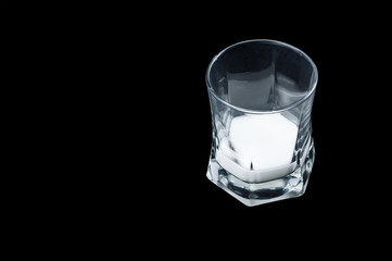 White milk in a transparent glass glass side view on a black background, isolate .