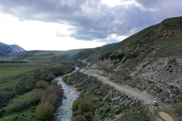 car rides through a gorge in the mountains