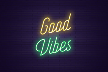 Neon lettering of Good Vibes. Glowing text
