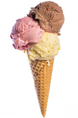 front view of real edible ice cream cone with 3 different scoops of ice cream (vanilla, chocolate,...