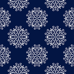 Floral seamless pattern. White flowers on dark blue background