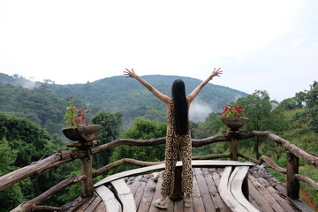 young woman traveling alone in nature