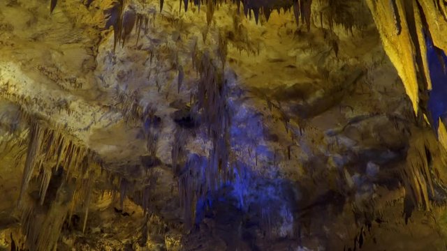 Mysterious Prometheus Cave in Georgia. Stalactites and stalagmites in a cave