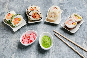 Sushi set on grey stone background.