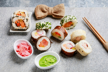 Sushi set on grey stone background.