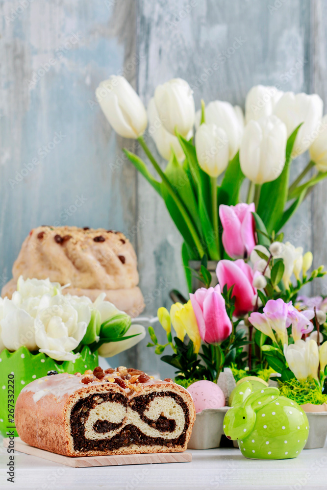 Sticker Poppy seed cake on easter table.