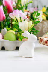 Ceramic rabbit figure on Easter table.