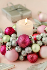 Fototapeta na wymiar Christmas present and candle holder made of glass balls