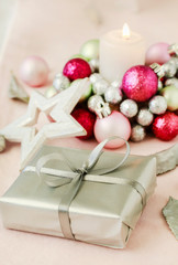 Fototapeta na wymiar Christmas present and candle holder made of glass balls