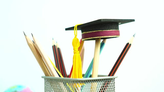 Graduate study or Education knowledge is power concept: Graduated cap Put on color pencil in basket. Conceptual for Educational is successs study or business world. Back to School ideas.