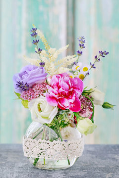 Bouquet with rose, peony, eustoma and lavender flowers.