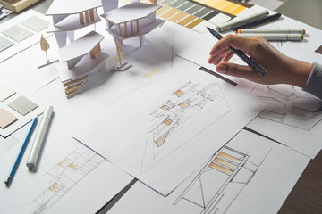 architect design working drawing sketch plans blueprints and making architectural construction...