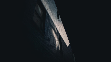 Sunlight peeking through building