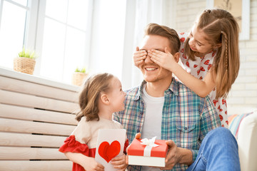 daughters congratulating dad